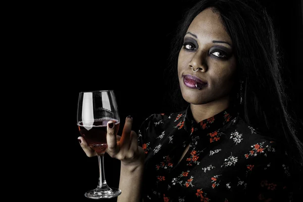 Sexy black woman holding a glass of wine — Stock Photo, Image