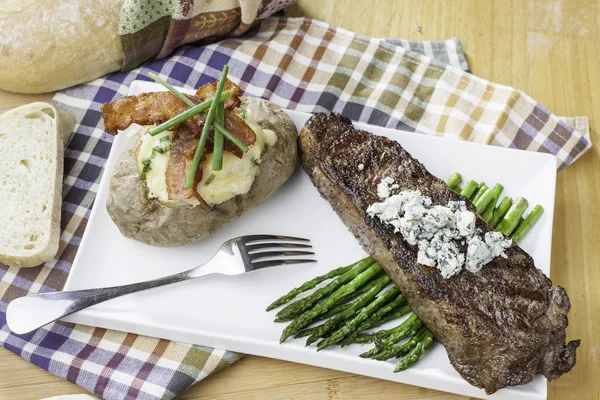 New york strip steak topped with bleu cheese — Stock Photo, Image