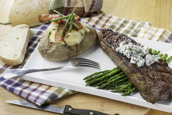 New york strip steak topped with bleu cheese — Stock Photo, Image