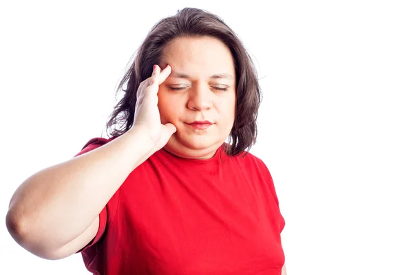 Woman in red shirt with hand on head — Stock Photo, Image