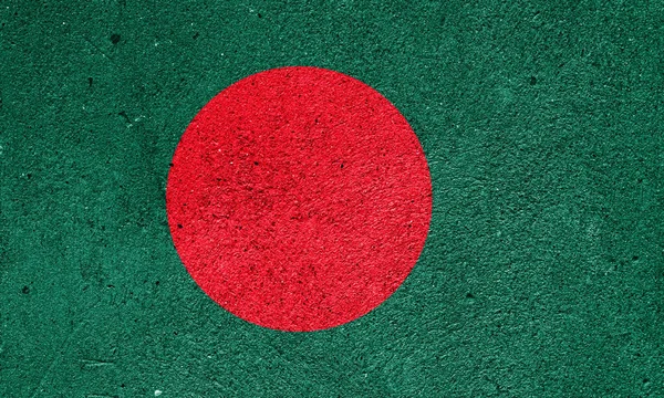 State flag of the People\'s Republic of Bangladesh on a plastered wall