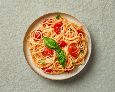Plate spaghetti with cherry tomatoes top view close-up studio shot