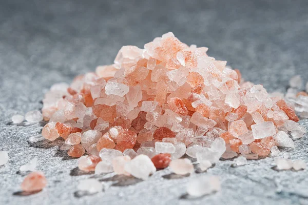 A pile of Himalayan pink salt. Close up from low angle view indoors