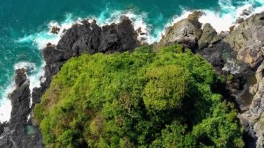 Aerial view with a drone over a cliff in El Nido, Philipplnes. Beautiful landscape in paradise, perfect for travel in nature under the sun 4K