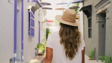 Slow motion shot of a woman walking in the walled city.