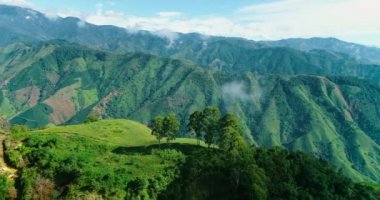 A drone shot scanning the green tropical Colombian heights in spring.