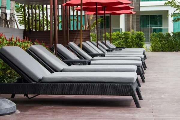 Lounge chairs by the pool — Stock Photo, Image