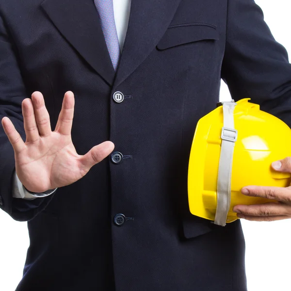 Ingeniero sosteniendo casco sobre fondo blanco —  Fotos de Stock