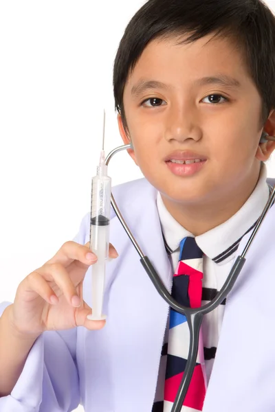 Boy holding a syringe — Stock Photo, Image