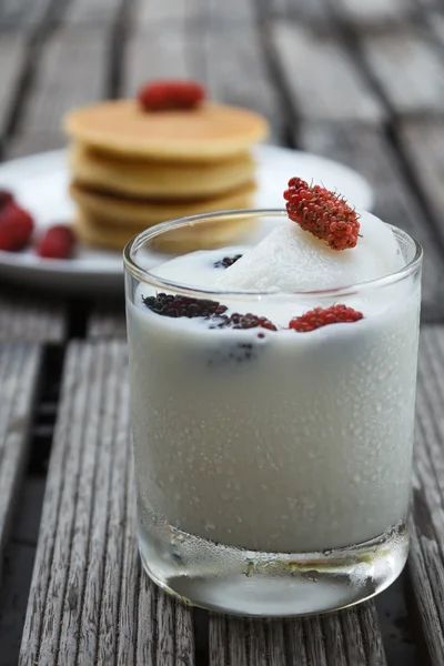 Glass of delicious icecream milkshakes and pancake — Stock Photo, Image