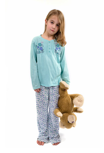 Sad girl in pajamas holding teddy