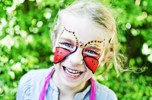 Chica con la cara pintada — Foto de Stock