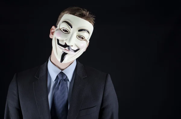 Man in suit wearing Vendetta mask — Stock Photo, Image