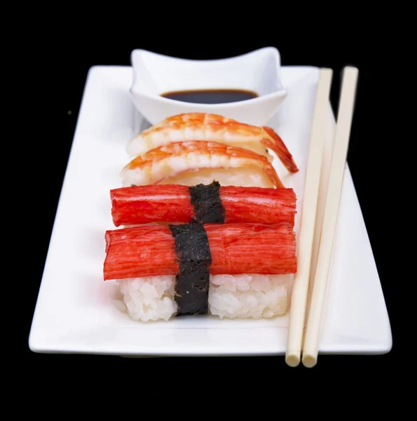 Placa blanca con sushi — Foto de Stock