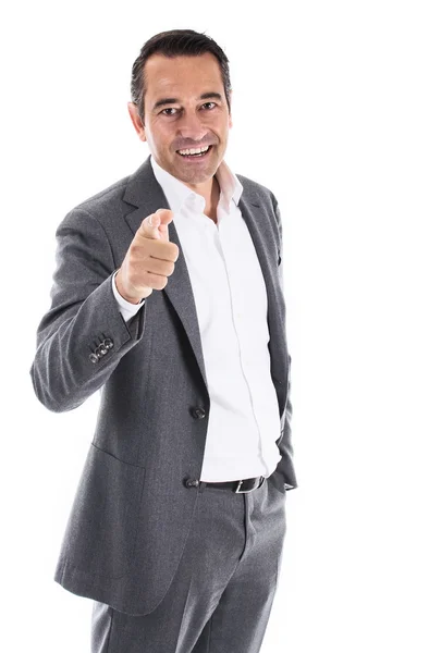 Smiling businessman pointing at camera — Stock Photo, Image