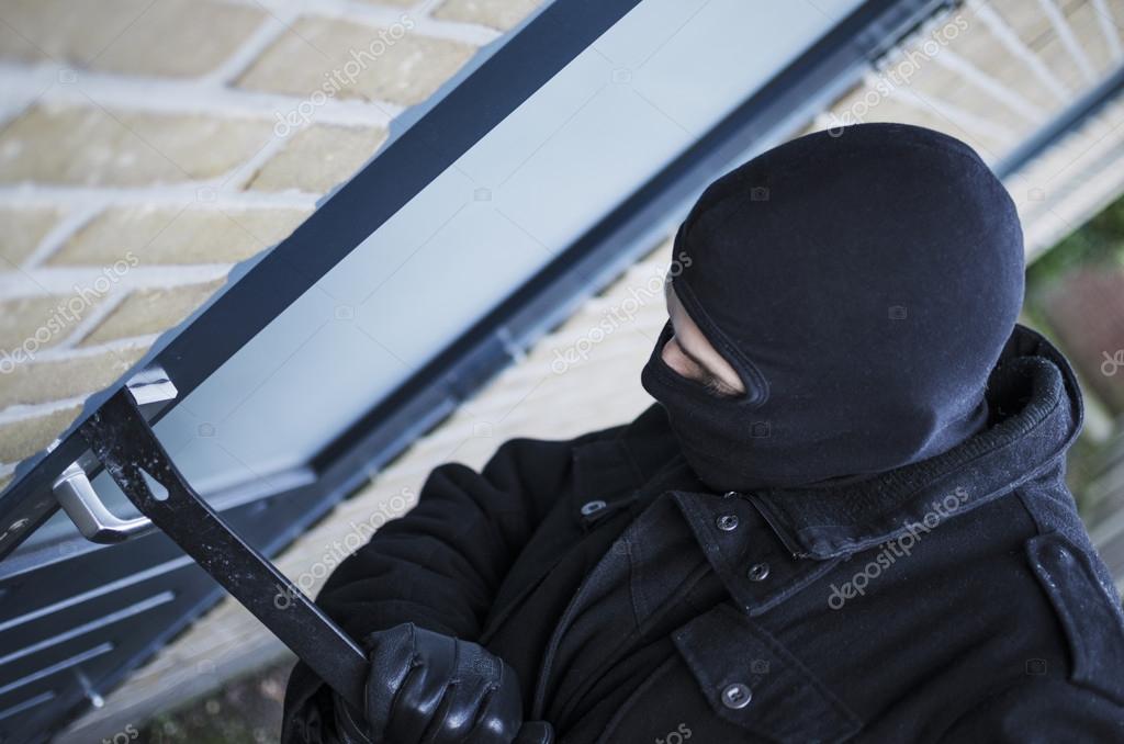 Burglar — Stock Photo © Mactrunk 37220549