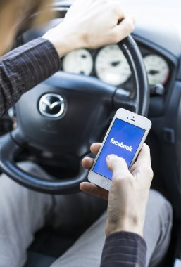 Using Social media Facebook in car clipart