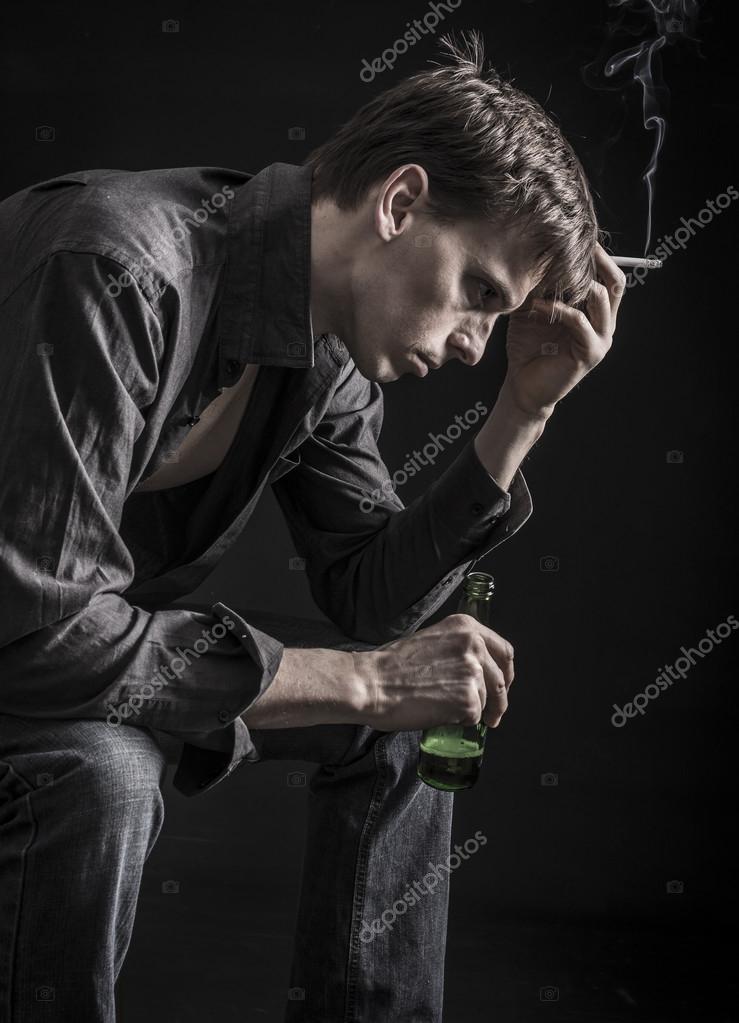 depositphotos_40612199-stock-photo-depressed-man-drinking-bear-and.jpg