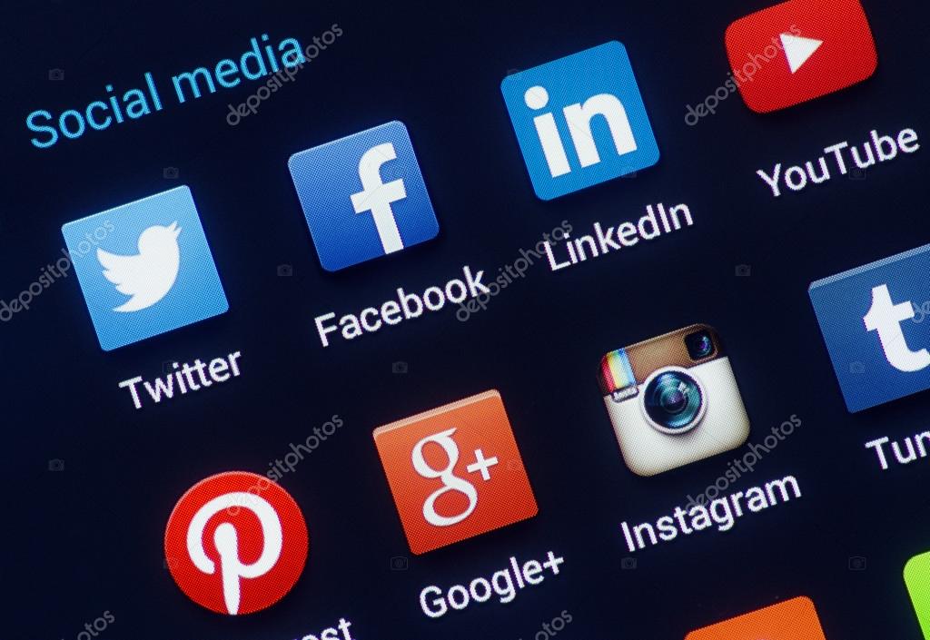Social media icons on smartphone screen. Closeup of popular social media logo's.