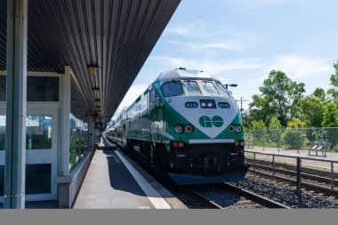 Burlington, Ontario, Canada - July 10 2021 : Go Train 618 arriving at Burlington GO Station platform.