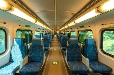 Toronto, ON, Canada - July 10 2021 : Interior of the GO Transit Go Train carriage during covid-19 pandemic period. Seat and acrylic divider.