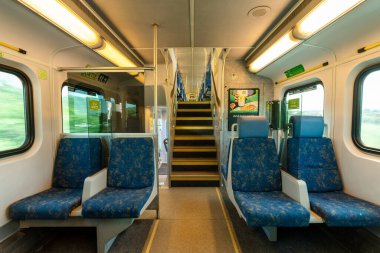 Toronto, ON, Canada - July 10 2021 : Interior of the GO Transit Go Train carriage during covid-19 pandemic period. Seat and acrylic divider.
