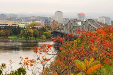 Alexandra Bridge. Autumn red leaves scenery in Ottawa, Ontario, Canada. Fall foliage.