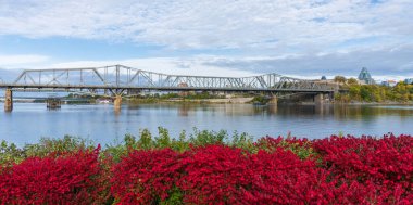 Alexandra Bridge. Autumn red leaves scenery in Ottawa, Ontario, Canada. Fall foliage.