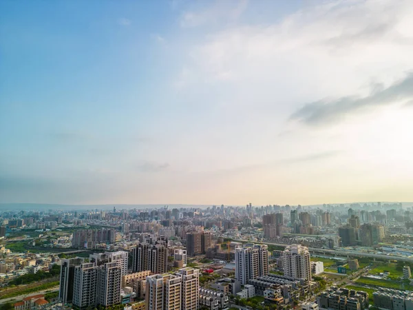 Taichung City, Taiwan - Aug 23, 2022 : Aerial view of Taichung city Beitun District skyline horizon in sunset time. Residential estate concept.