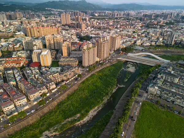Taichung City, Taiwan - Aug 23, 2022 : Aerial view of Han River, Taichung city Beitun District buildings in sunset time.