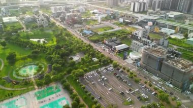 Taichung City, Taiwan - Aug 23, 2022 : Aerial view of Taichung Nanxing Park, Taichung Metro Beitun District in sunset time.