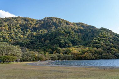 Autumn foliage scenery of Lake Towada in sunny day. Towada Hachimantai National Park, Aomori, Japan