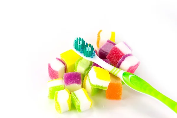 Toothbrush on candy background — Stock Photo, Image