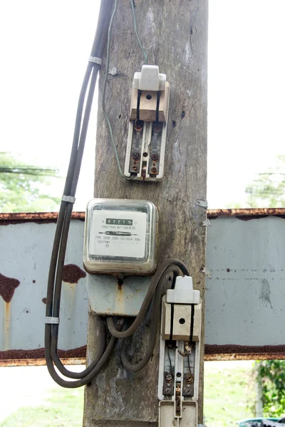 Old electricity meter and Old breaker hanging — Stock Photo, Image