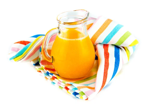 Orange juice in pitcher on white background — Stock Photo, Image