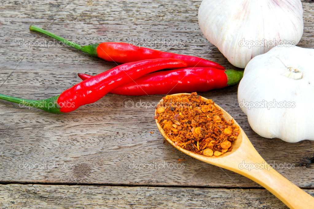 Bright spices and garlic on an old wooden