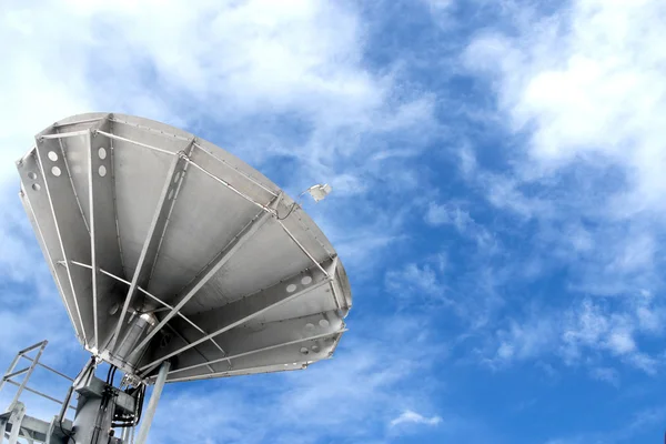 Satellite dishes antenna on blue sky with clouds — Stock Photo, Image
