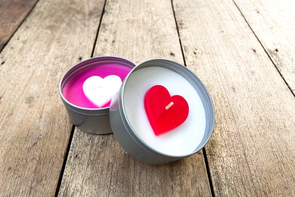 Heart shaped candles on wooden — Stock Photo, Image