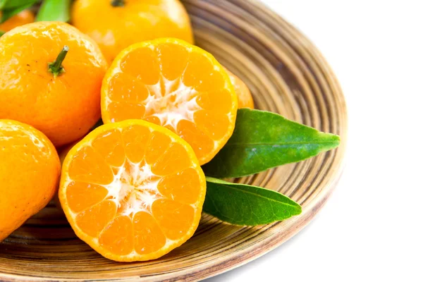 Orange in wood bowl — Stock Photo, Image