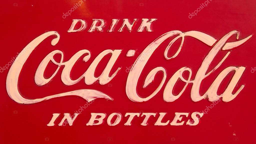 ROSMALEN, THE NETHERLANDS - OCTOBER 13: A vintage Coca Cola logo on a Coke machine on October 13, 2012 in Rosmalen, Holland
