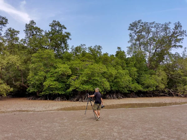 Male Asian Traveler Holding Camera Tripod Walking Mangrove Forest Low — Stock Photo, Image