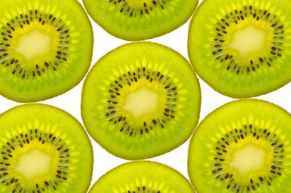 Primer plano de rodajas de fruta kiwi como fondo —  Fotos de Stock