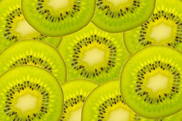 Primer plano de rodajas de fruta kiwi como fondo —  Fotos de Stock