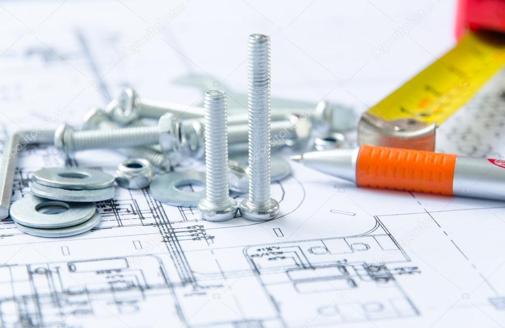Nuts and bolts over architectural plan