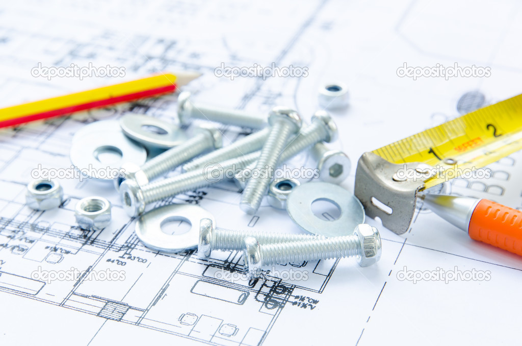 Nuts and bolts over architectural plan