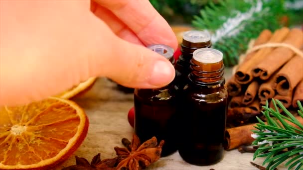 Christmas essential oils in bottles. Selective focus. — Stock Video