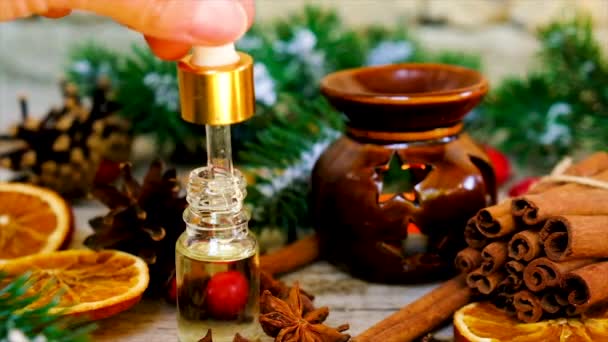 Christmas essential oils in bottles. Selective focus. — Stock Video