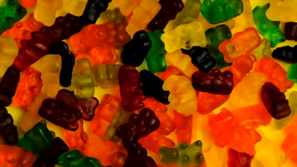 The child eats vitamins jelly candy. Selective focus. — Stock Video