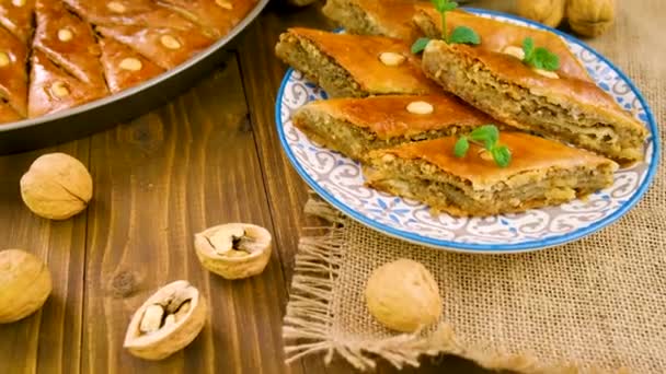 Baklava and Turkish tea on the table. Selective focus. — Stock Video