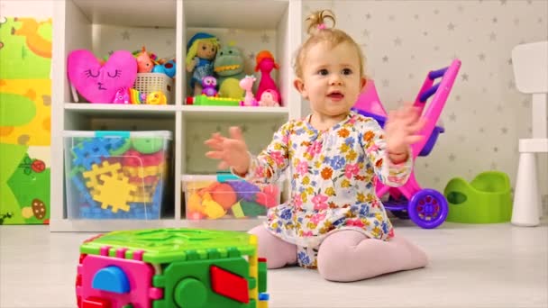 The child plays with toys in the room. Selective focus. — Stock Video